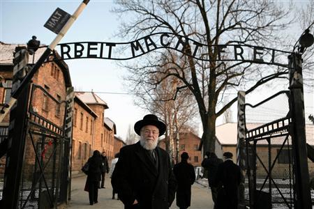 Israeli Rabbi Meir Lau stands at the main gate of the former Nazi Death Camp of Auschwitz
